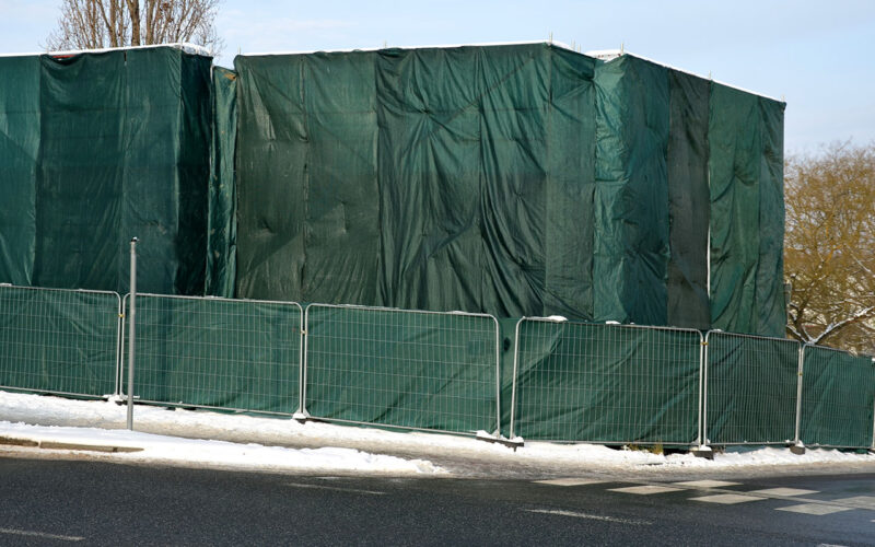 bigstock-A-Group-Of-Workers-Covered-The-467744909